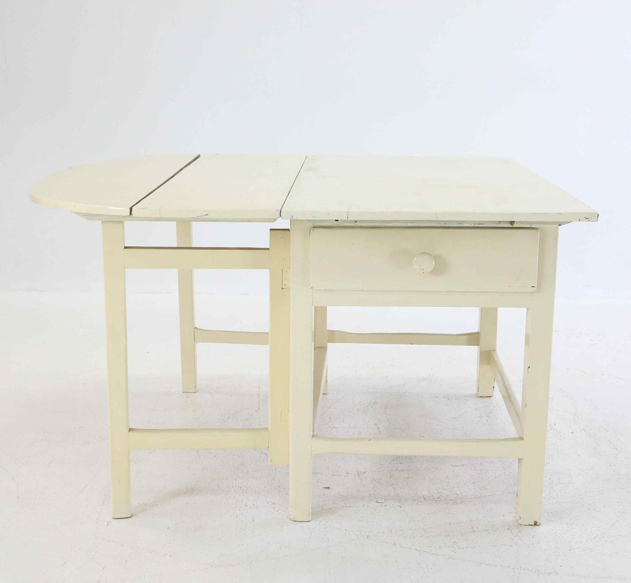 A white painted percussion table, 19th century.