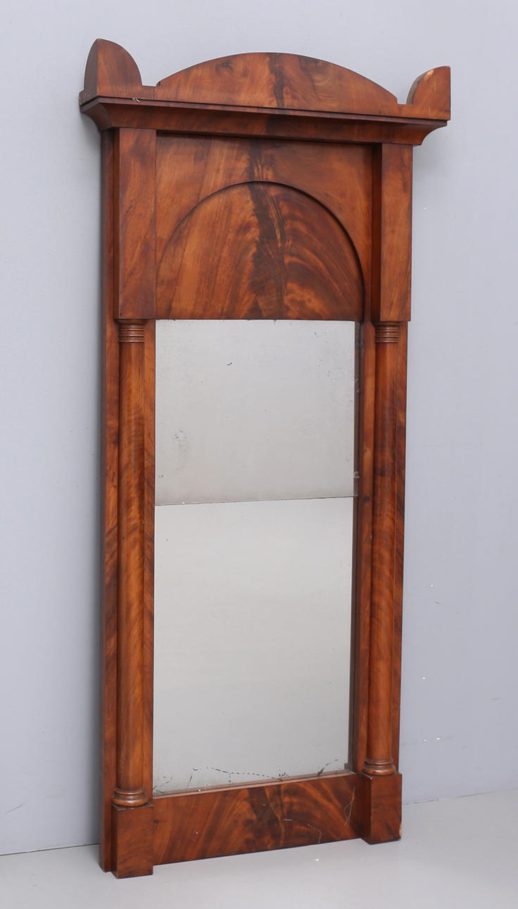 A 18th/20th century mirror with columns.