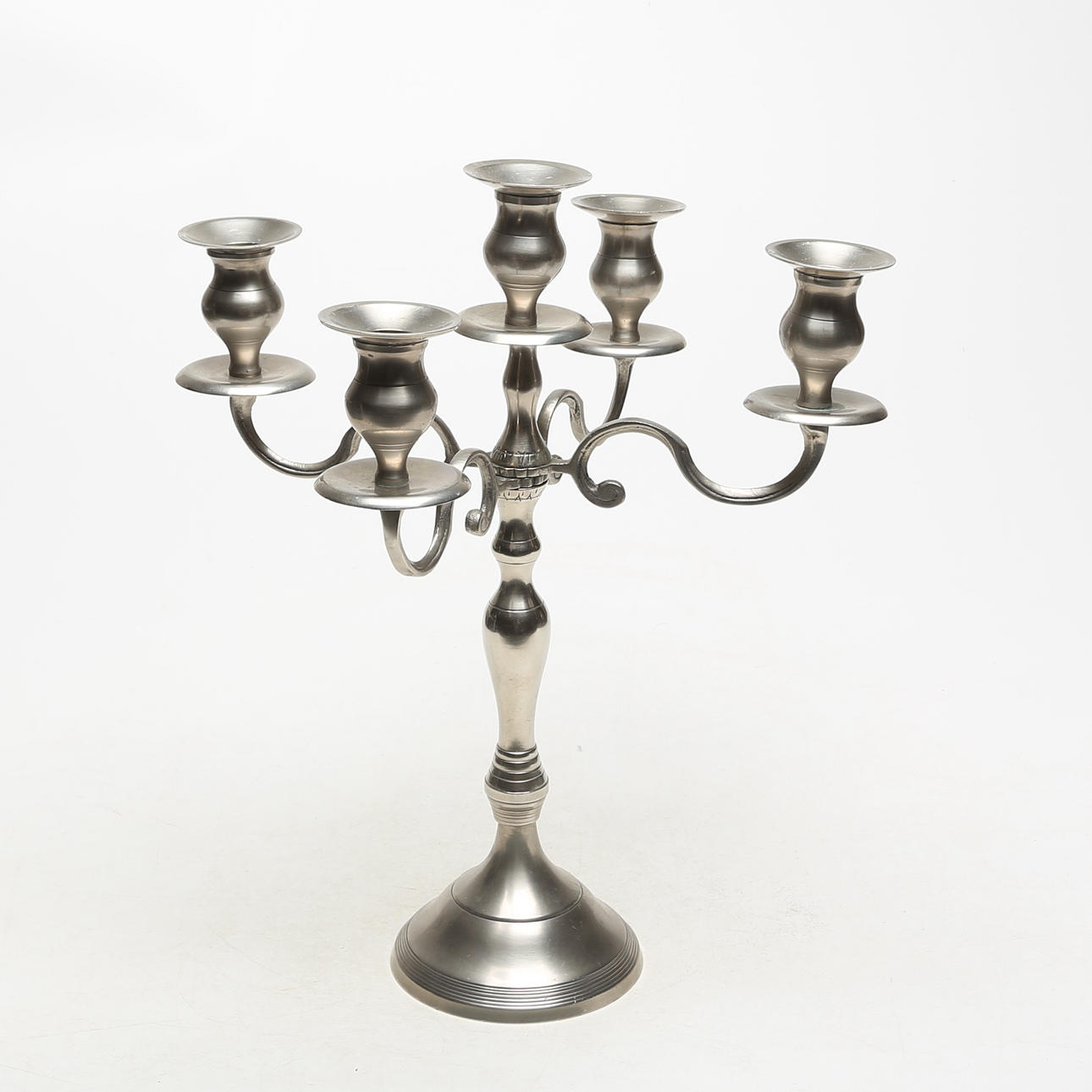 A metal candlestick, modern.
