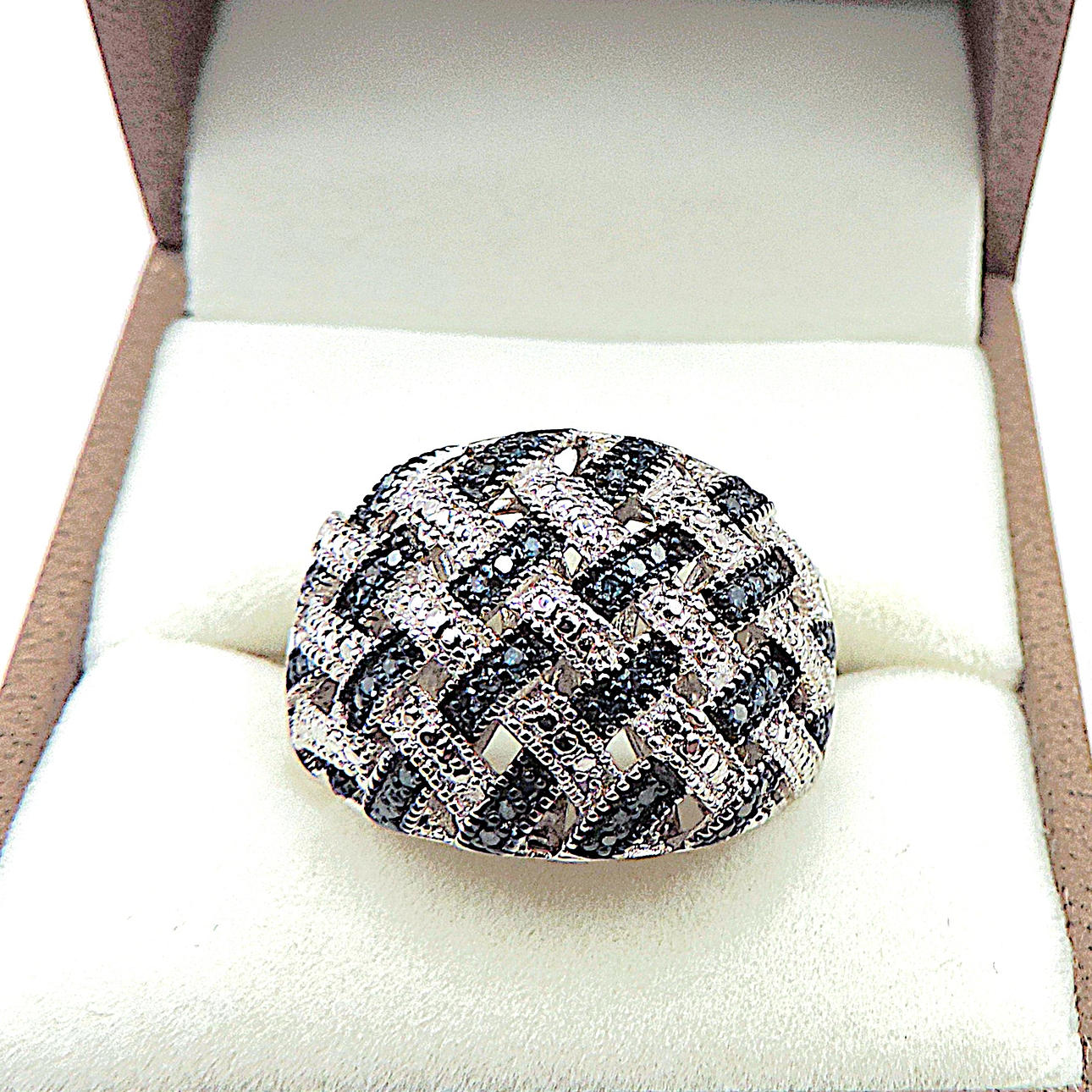 PLATINUM ON STERLING SILVER BLUE DIAMOND RING.