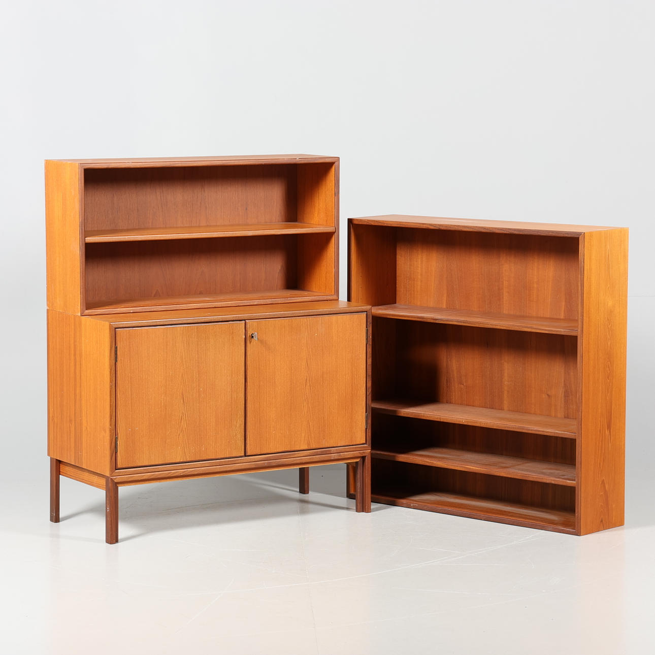 A three-piece teak bookcase, 1960s.