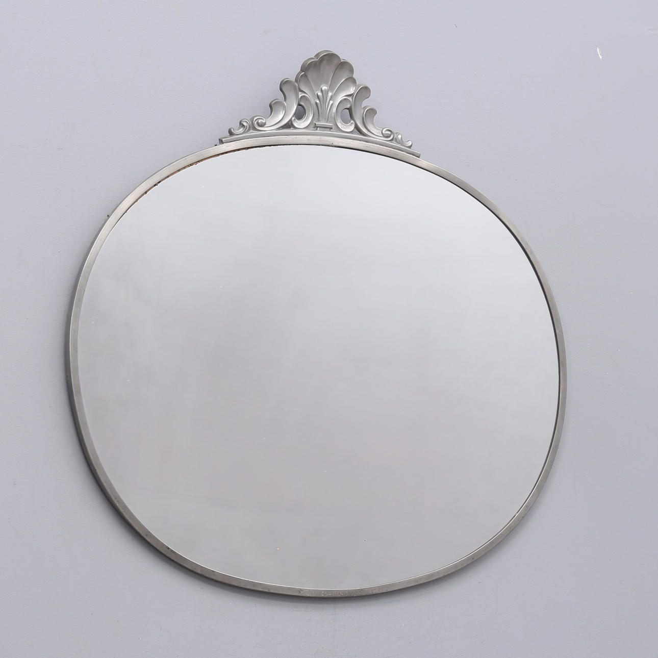 A 1930s pewter frame mirror.