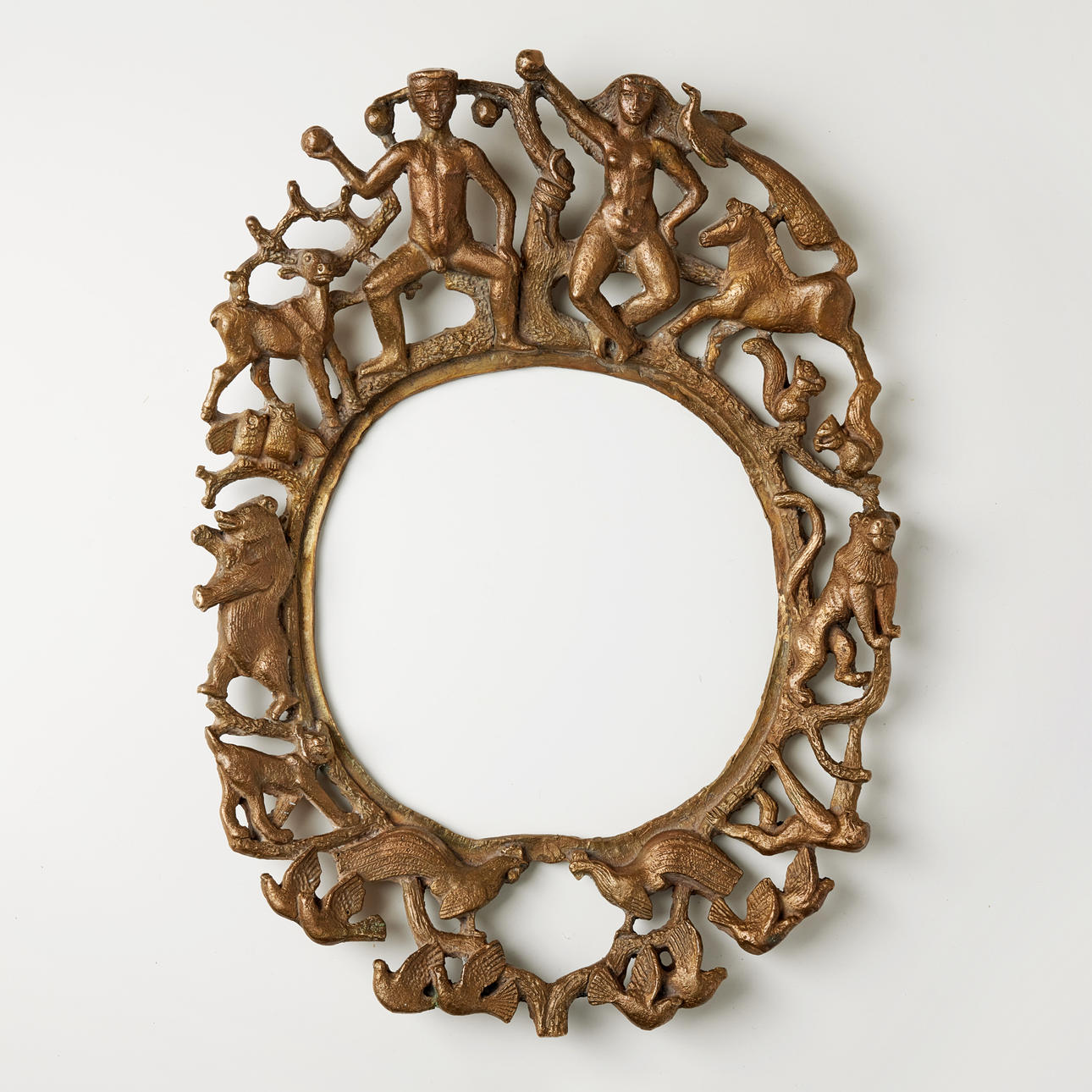 STIG BLOMBERG. Mirror frame, bronze, richly decorated in form of Adam and Eve in the Garden of Eden, model designed in 1939.