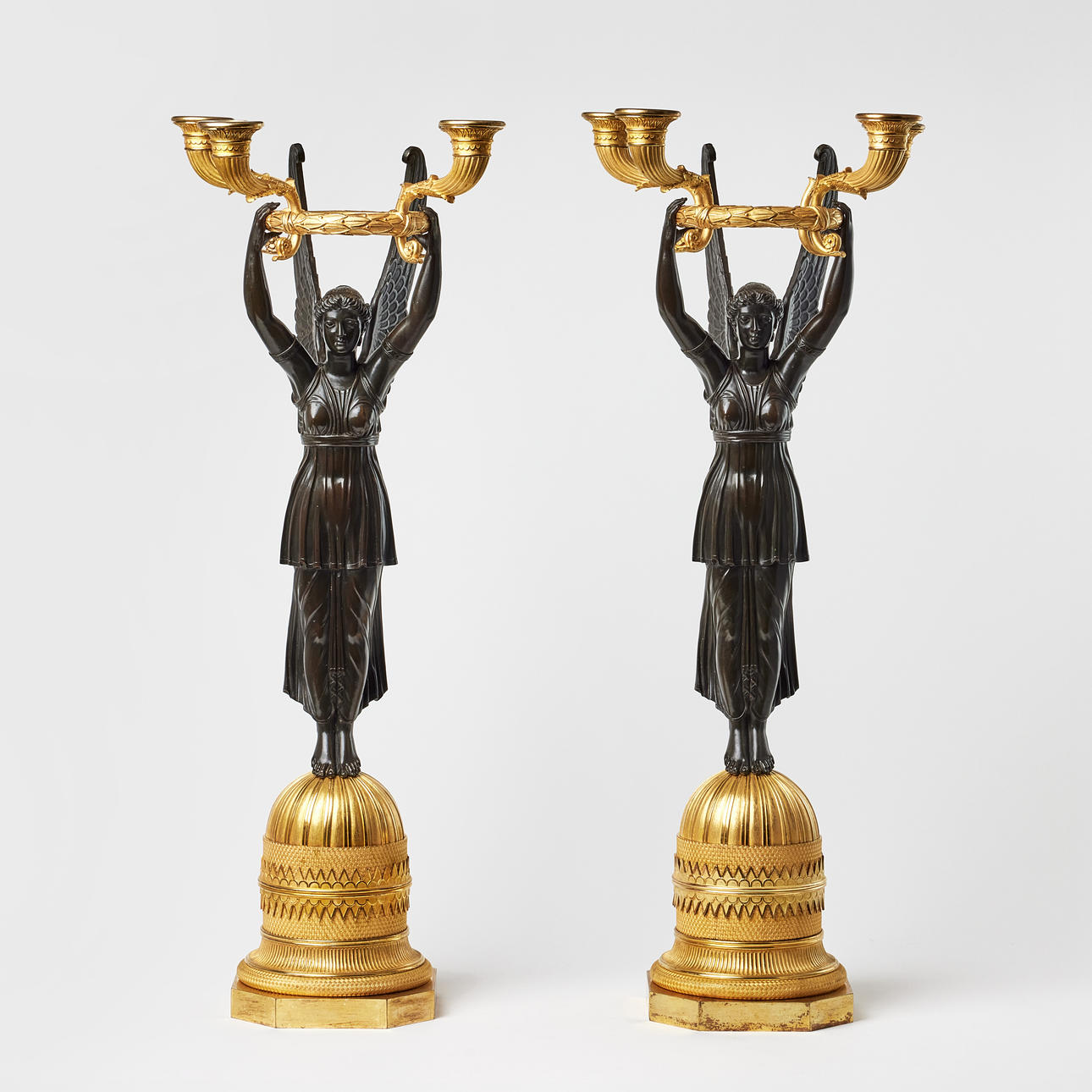PIERRE-PHILIPPE THOMIRES WORKSHOP (sculptor and bronze foundry in Paris, 1751-1843) attributed, a pair of candelabras, high class Paris works in the empire, 1810s, for each four candles, frosted and polished burnt-gilt and dark-patinated bronze.