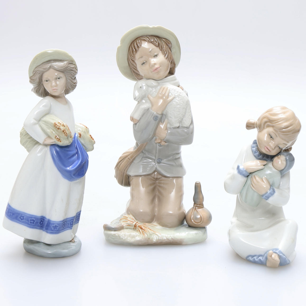Three porcelain figurines, Zaphir, Spain.