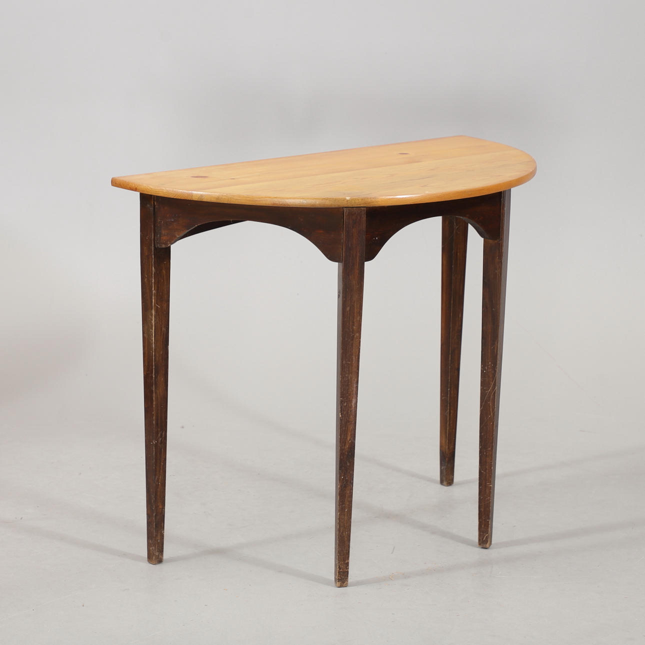 A 20th century half-moon table.