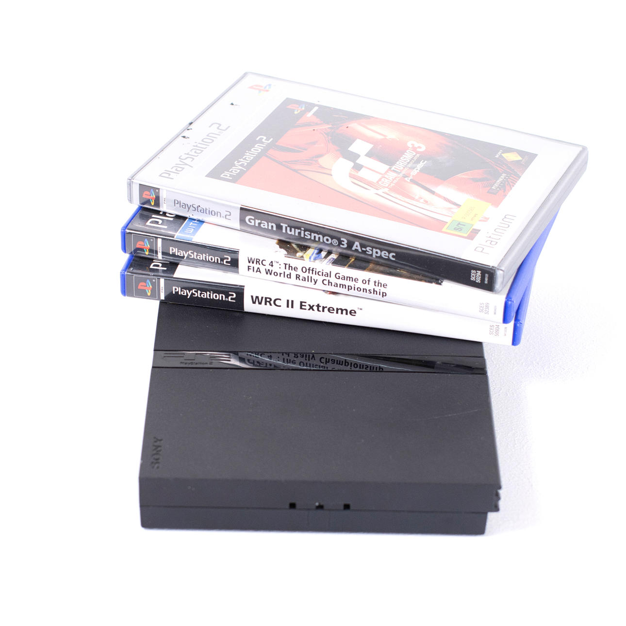 A PLAYSTATION 2 game console with accessories, 21st century.