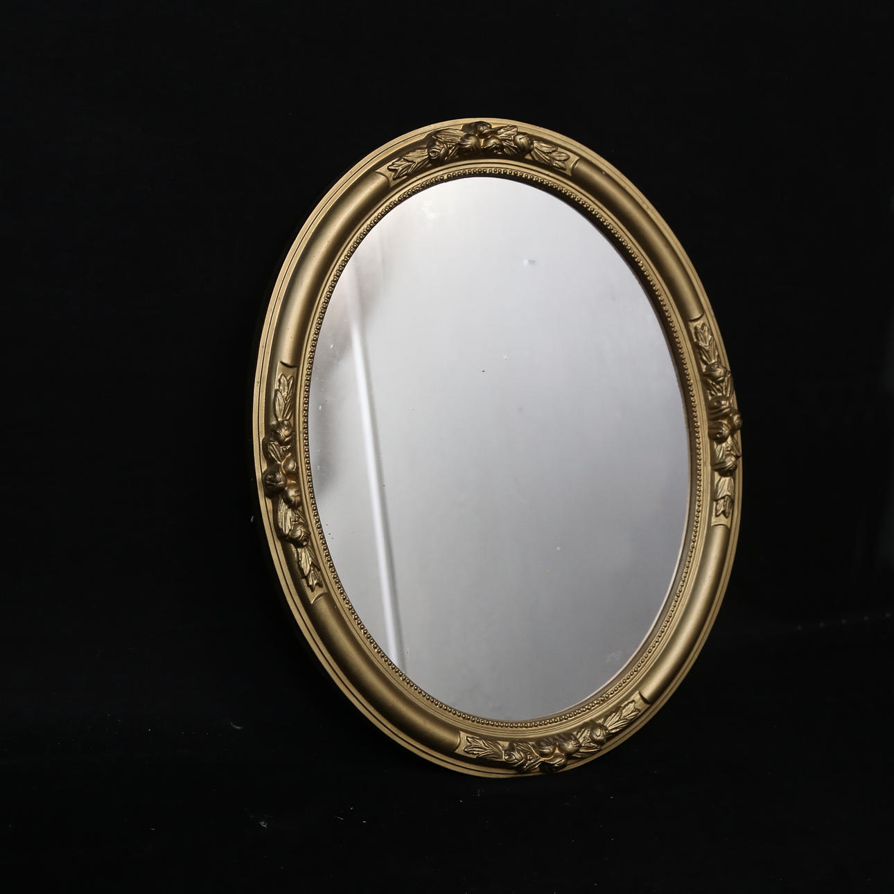 A 1900 century oval mirror.