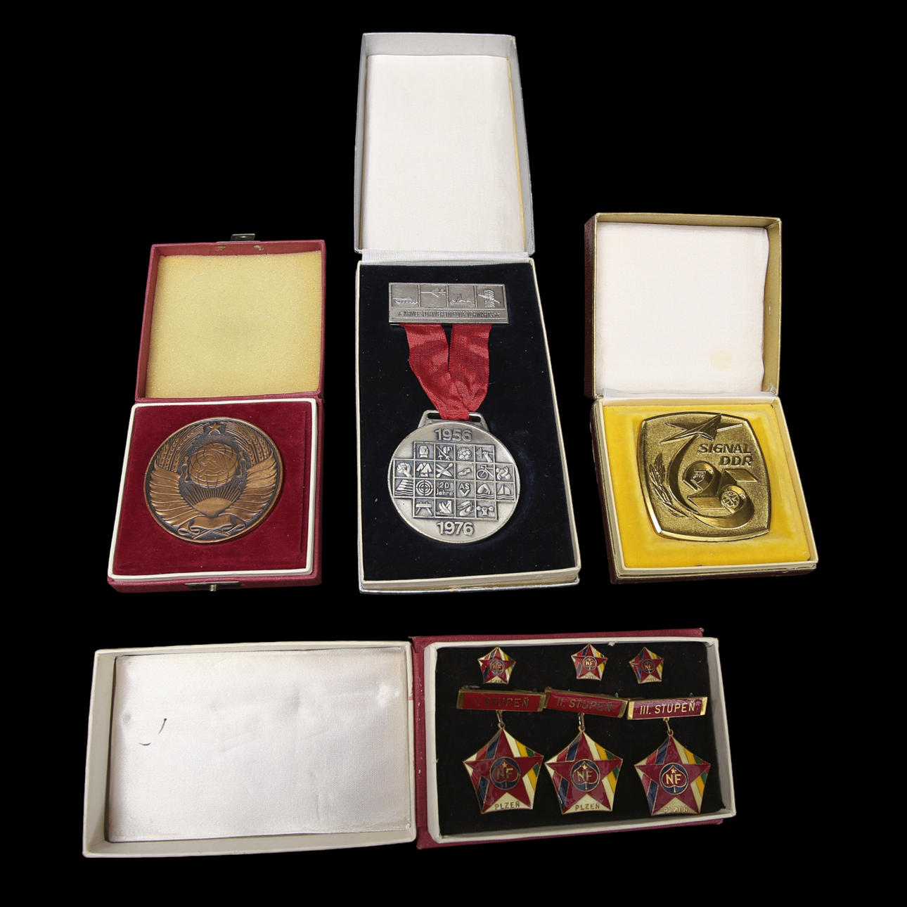 VARIOUS PLAQUES, and empty cases from Warsaw Pact countries.