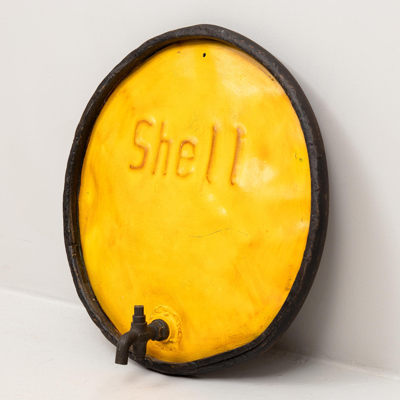 A mid-20th century Shell oil barrel lid.