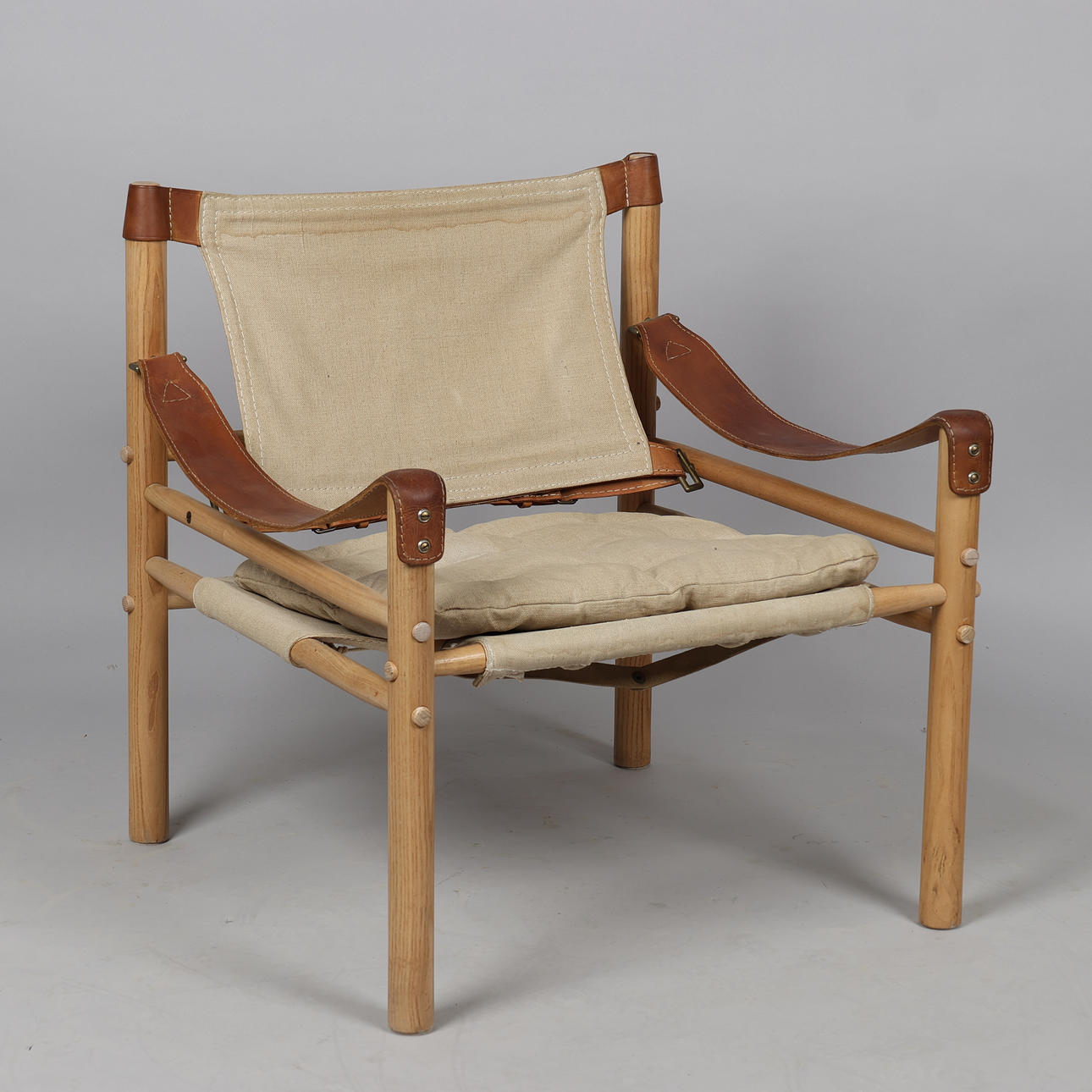ARNE NORELL. “Scirocco” safari armchair, solid ash, canvas and core leather frame, Sweden.