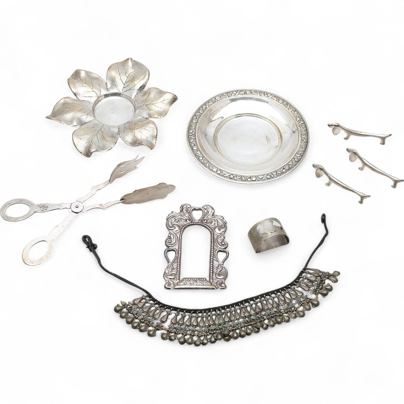Various silvery metal objects, 20th Century.