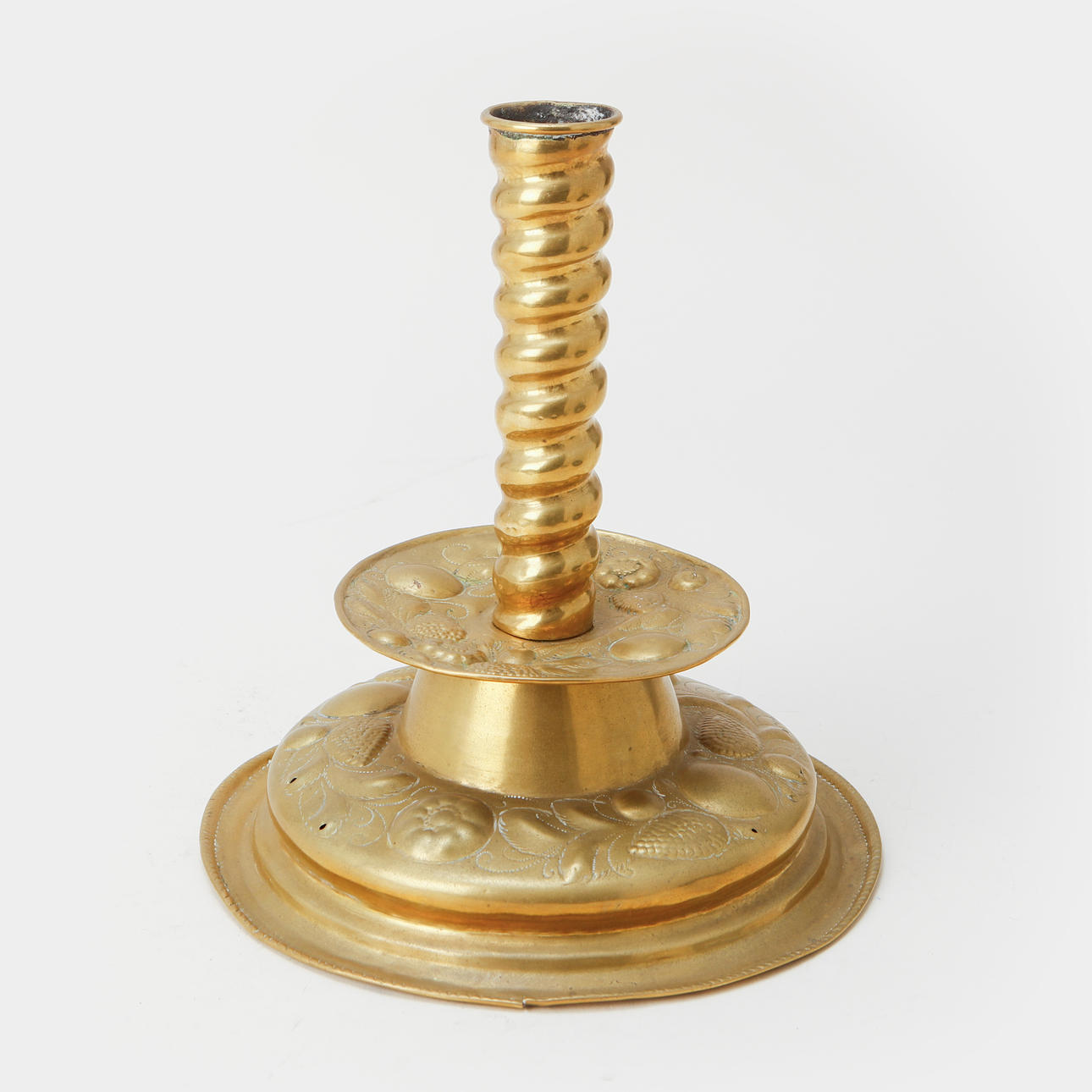 A baroque brass candlestick, 18th century.