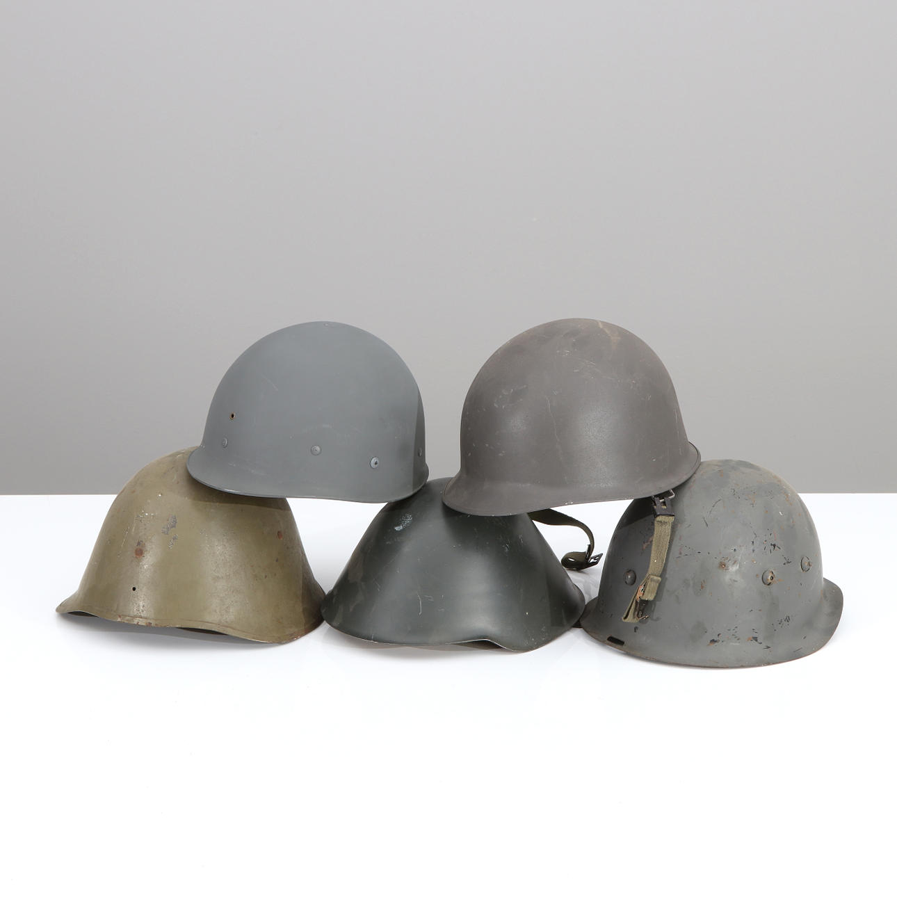 MILITARY HELMETS, FOUR PCS. 20th century.