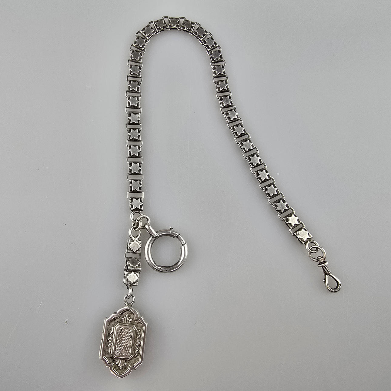 - Pocket watch chain with medallion pendant, silver (tested).