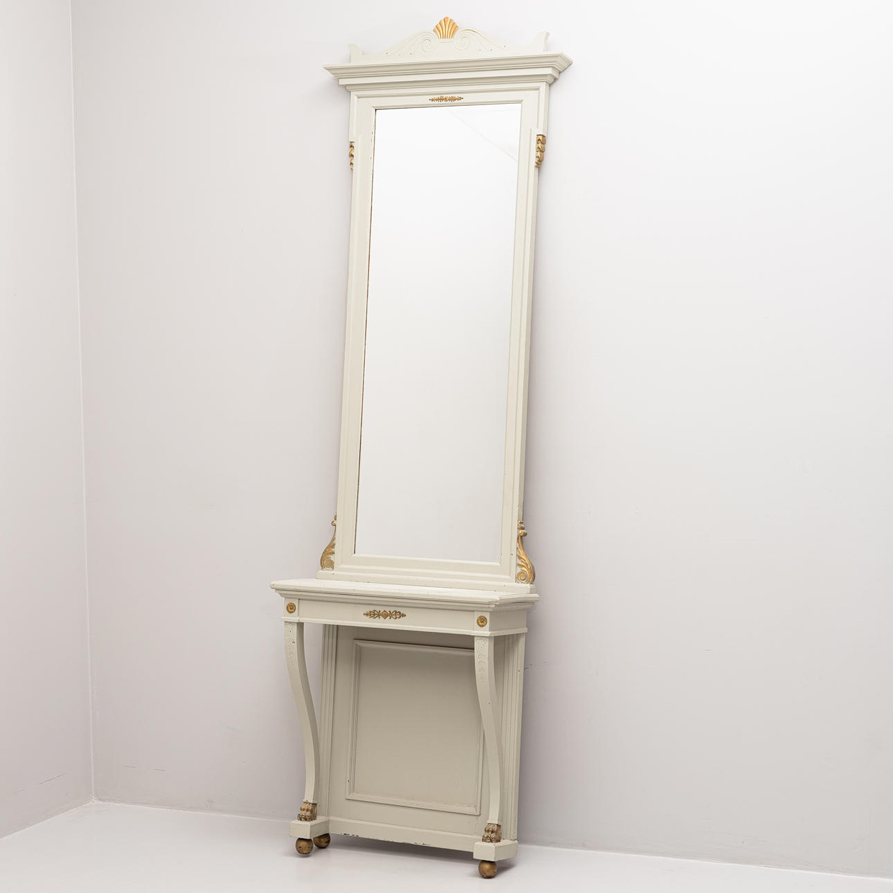 An Empire style mirror with console table, first half of the 20th century.
