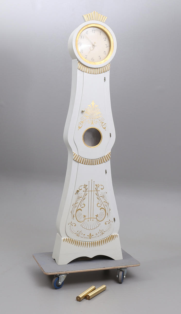 A 20th century curved floor clock.