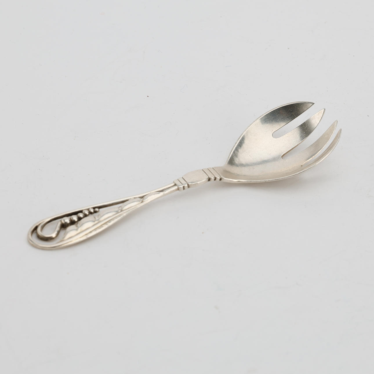 GEORG JENSEN, a sterling silver serving spoon, 1933-1944.