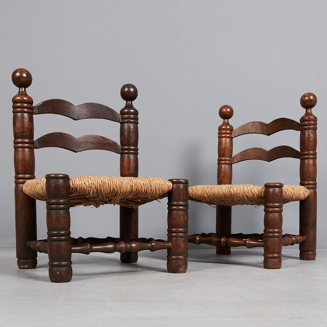 CHARLES DUDOUY. Two chairs, raffia, oak, 1940s (2).