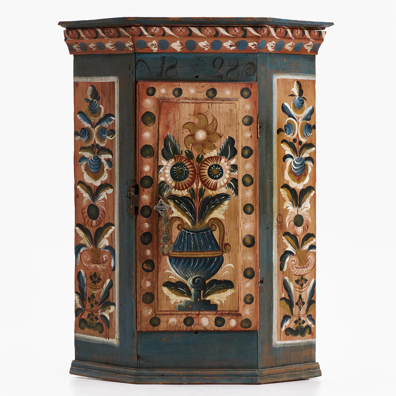 A CORNER CABINET, Delsbo, Hälsingland, dated 1828, polychrome painted decor with flowers.