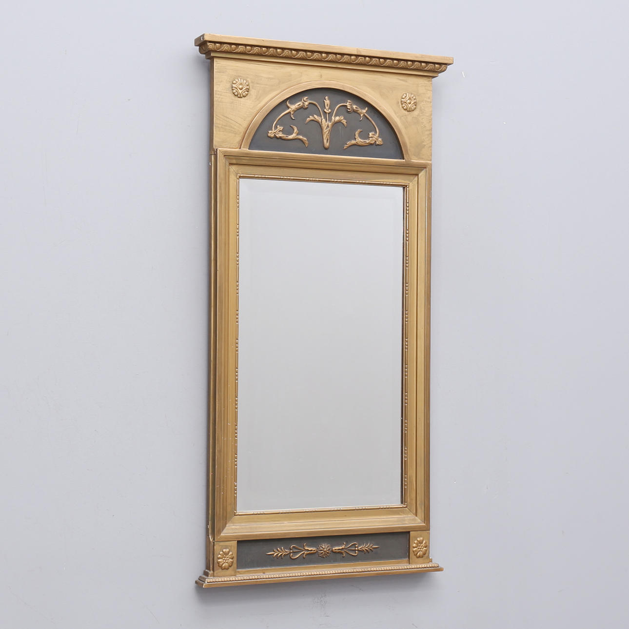A late Gustavian style mirror, first half of the 20th century, faceted glass.