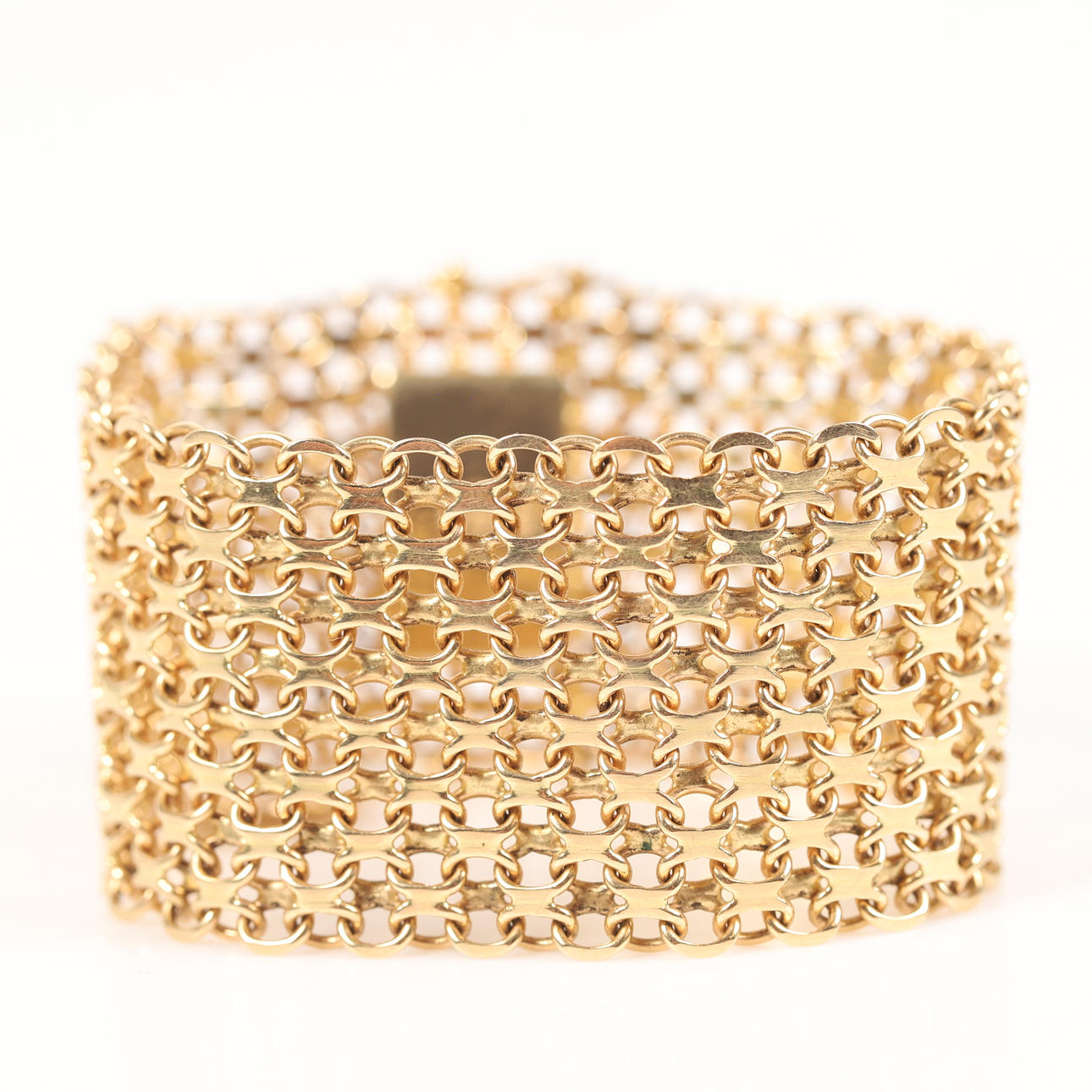 BRACELET, x-link with charm, 18 K gold.