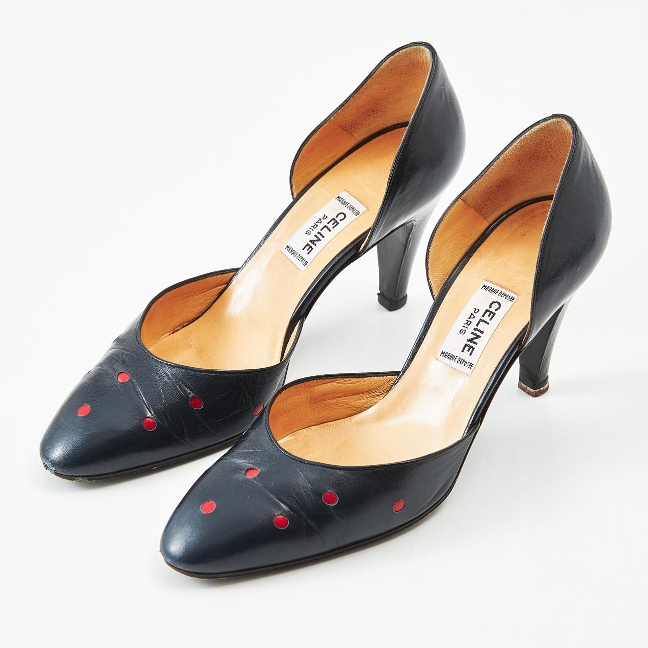 CELINE, pumps in blue leather with red dots.
