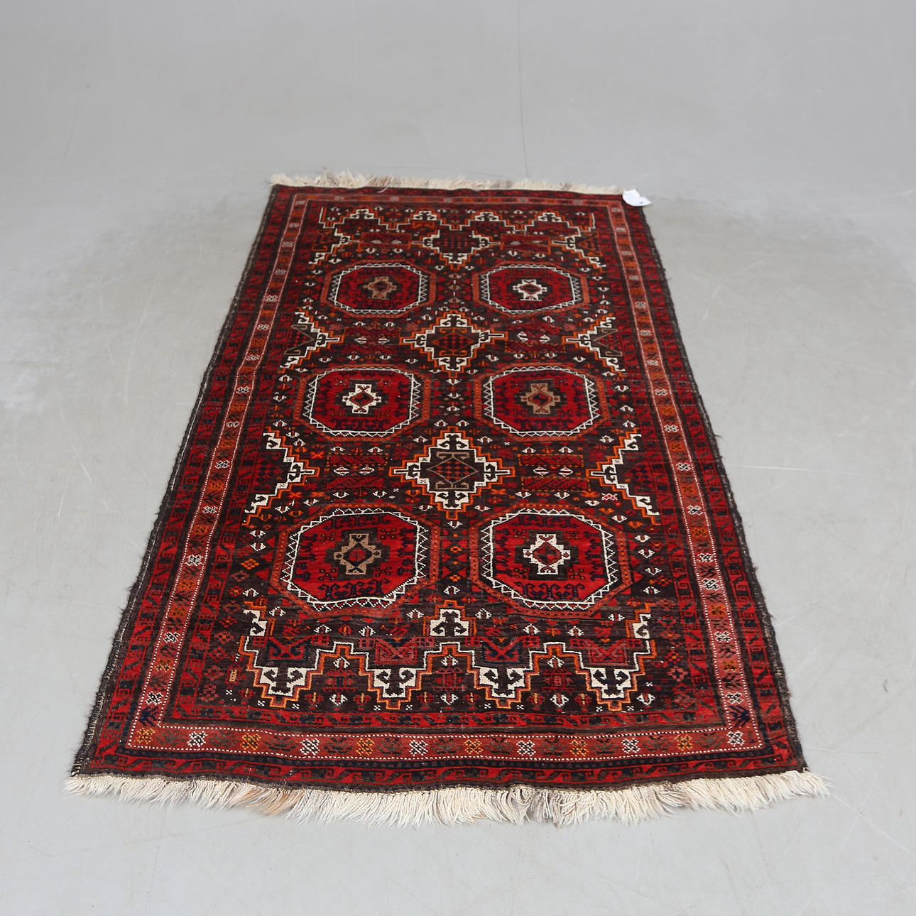 A CARPET, oriental, approx 187x107cm.