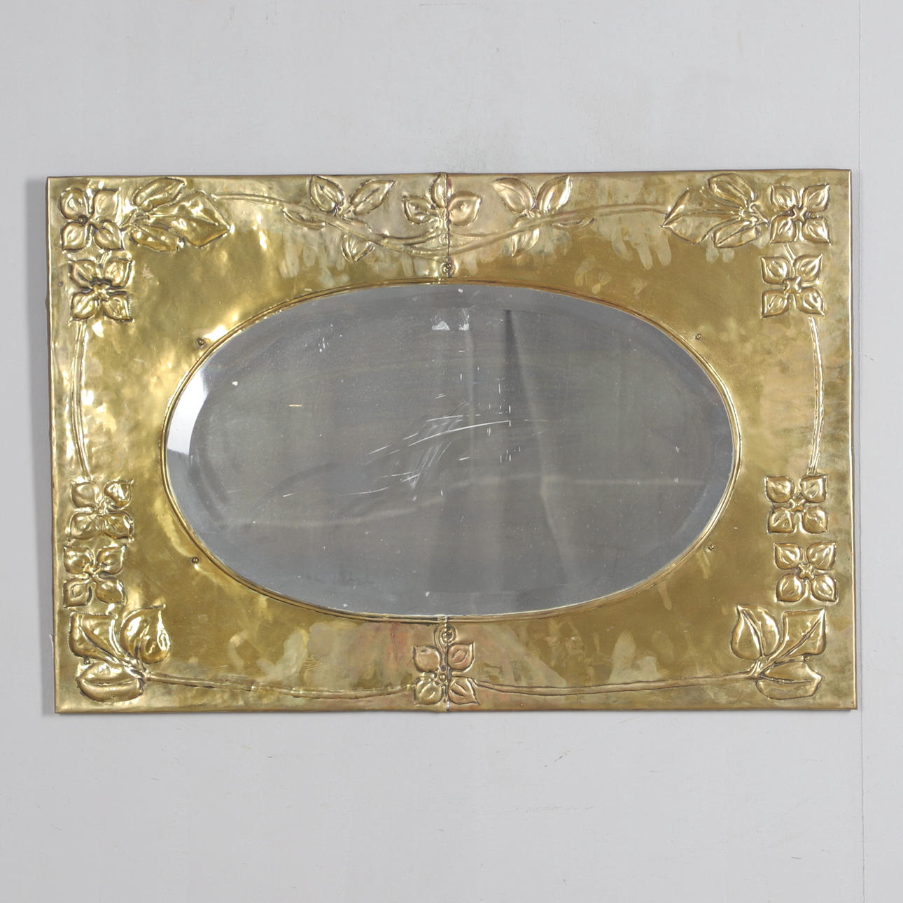 LARGE ARTS & CRAFTS BRASS MIRROR.