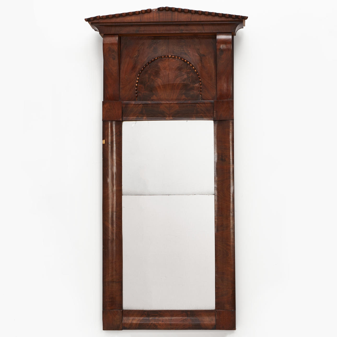 A 19th century empire wall mirror, mahogany.
