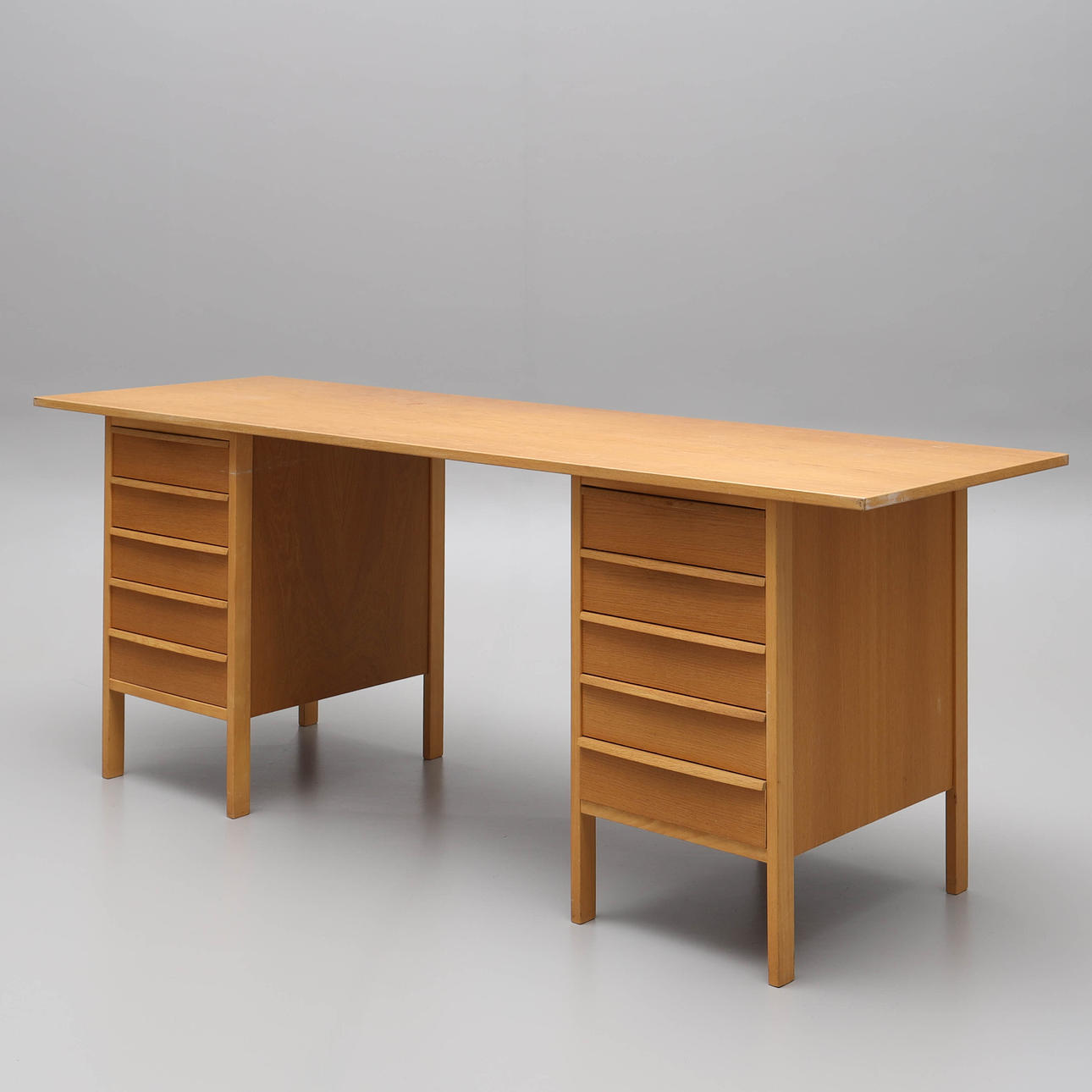 A 1960s/70s oak veneer desk.
