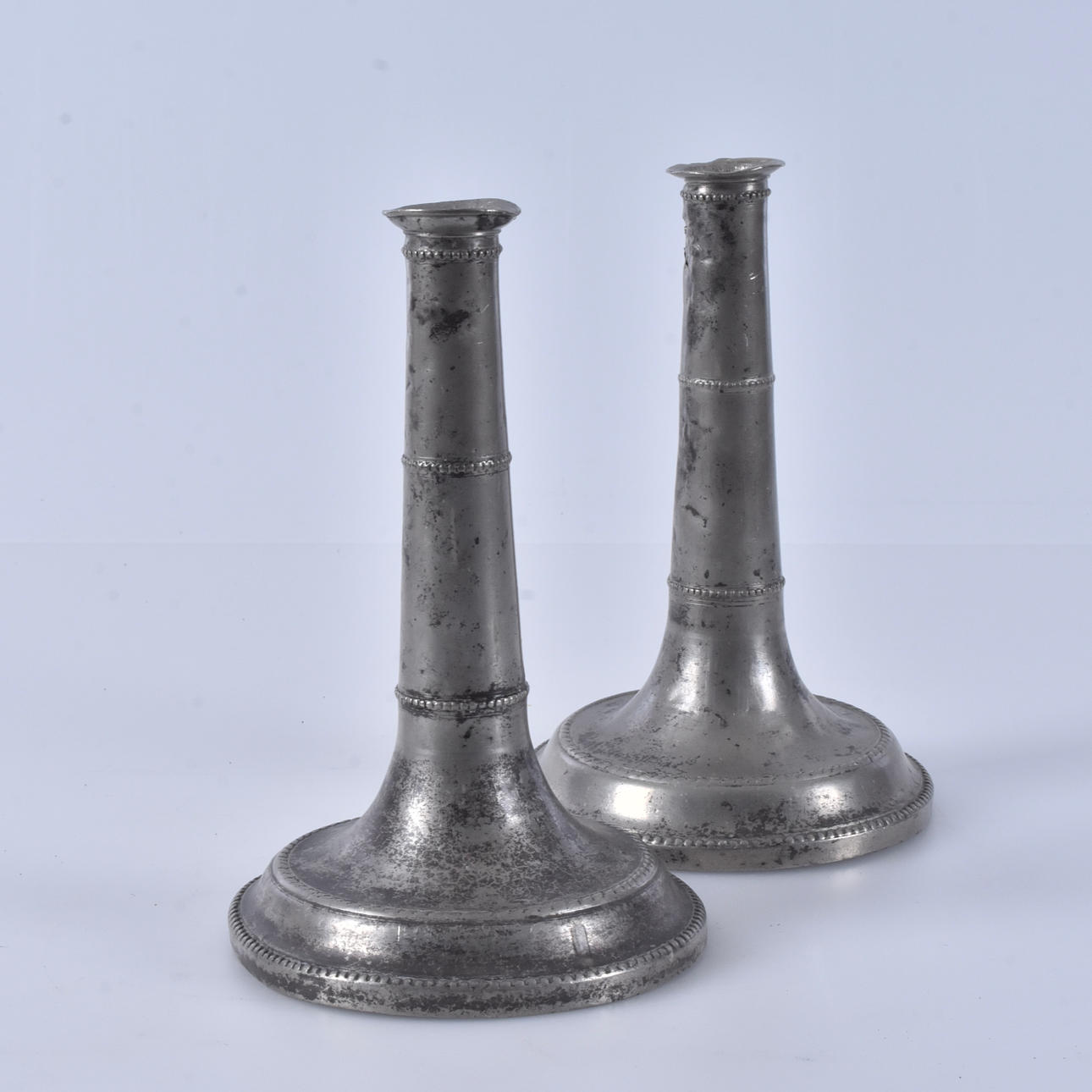 A pair of tin candlesticks, Lund, 1802.