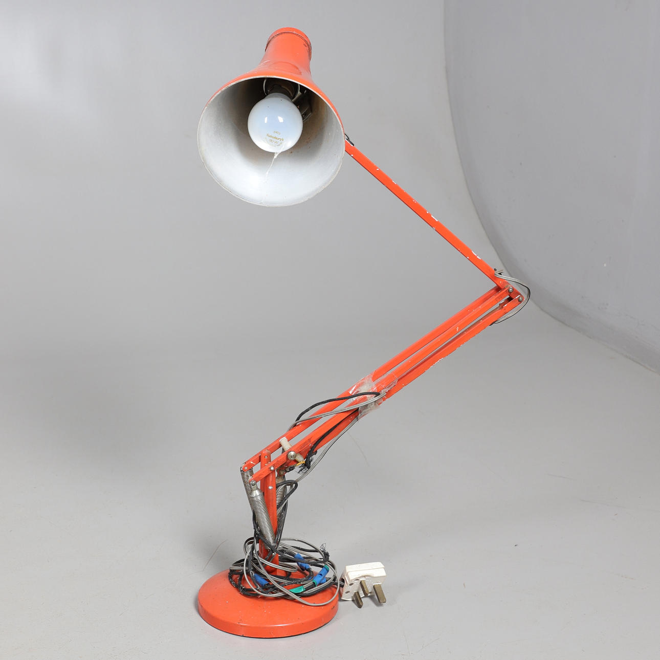 A VINTAGE HERBERT TERRY & SONS ANGLEPOISE LAMP, ORANGE.