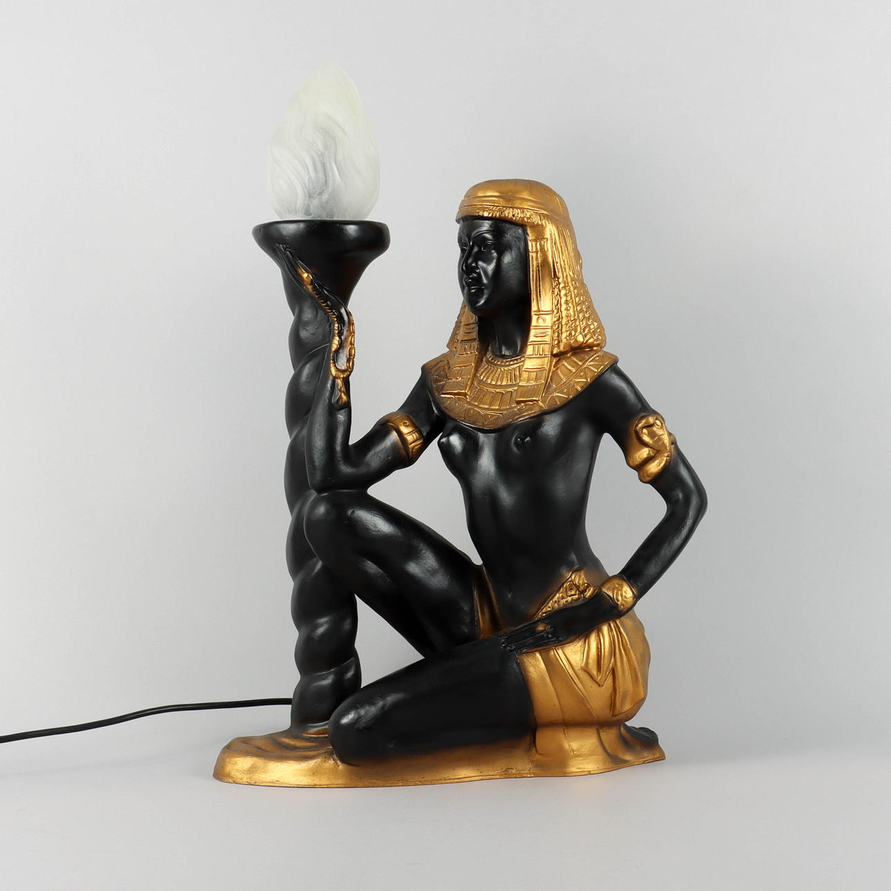 A 21st-century Egyptian kneeling table lamp.