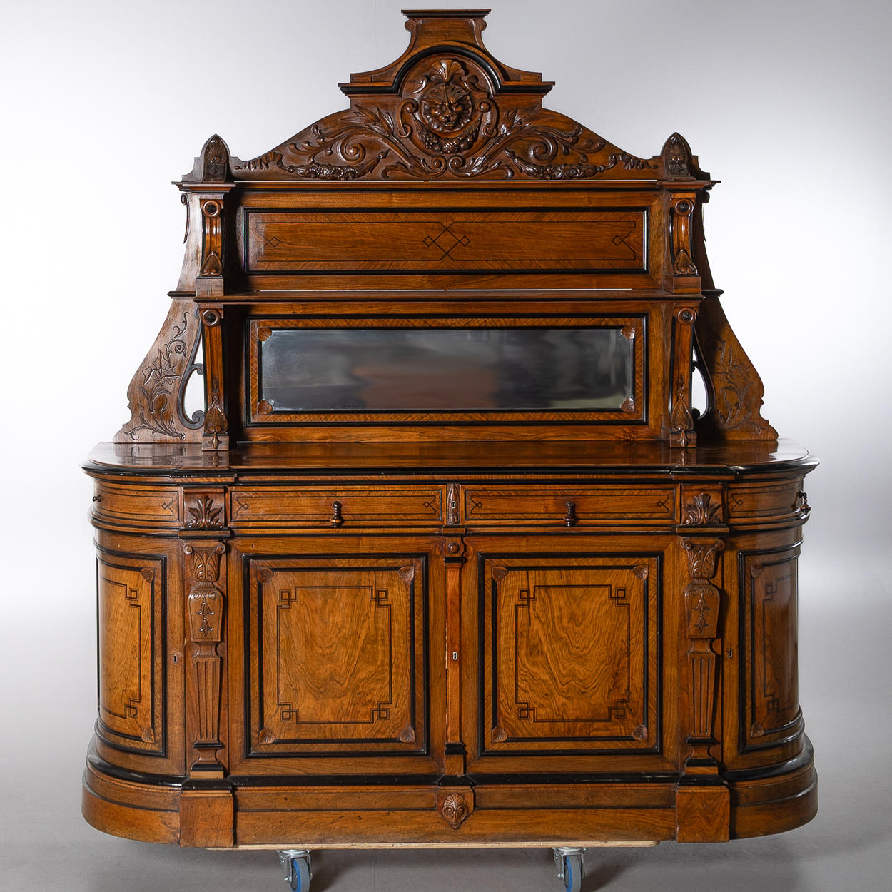 A sideboard with an essay, veneered in walnut, later part of the 19th century.