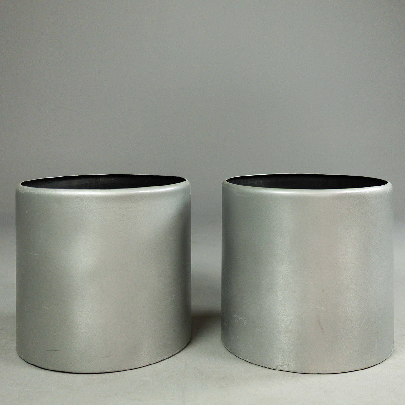 A PAIR OF LARGE SILVERED DRUM PLANTERS (2).