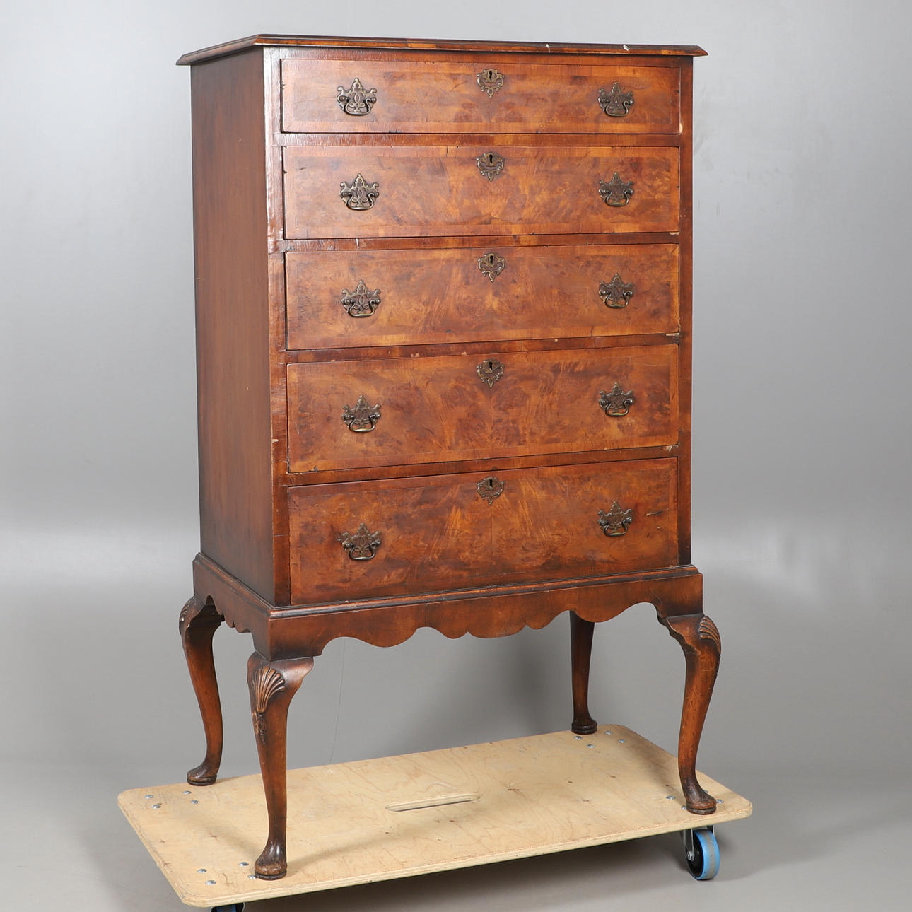 A QUEEN ANNE STYLE WALNUT CHEST ON STAND.