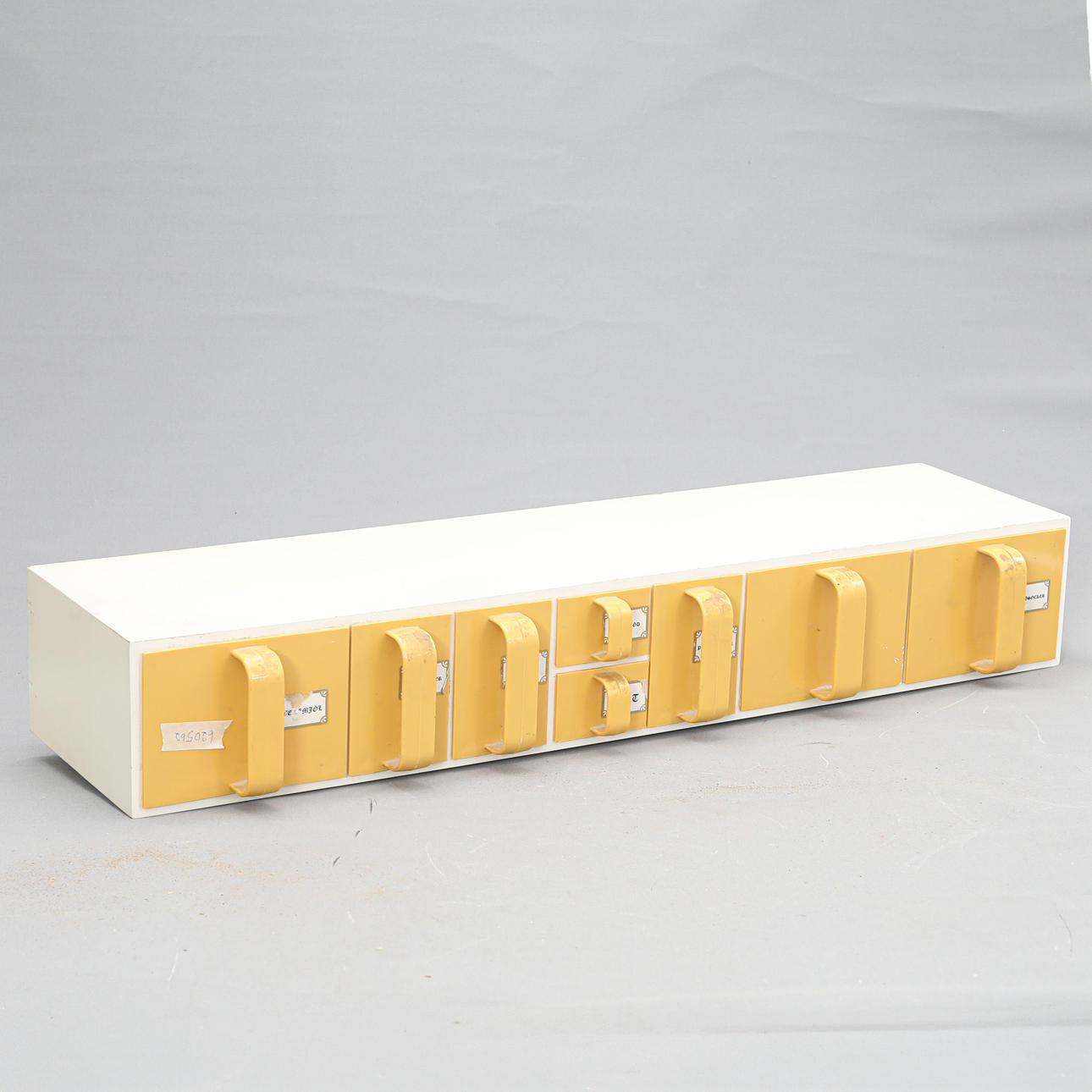 A spice rack, mid 20th century.