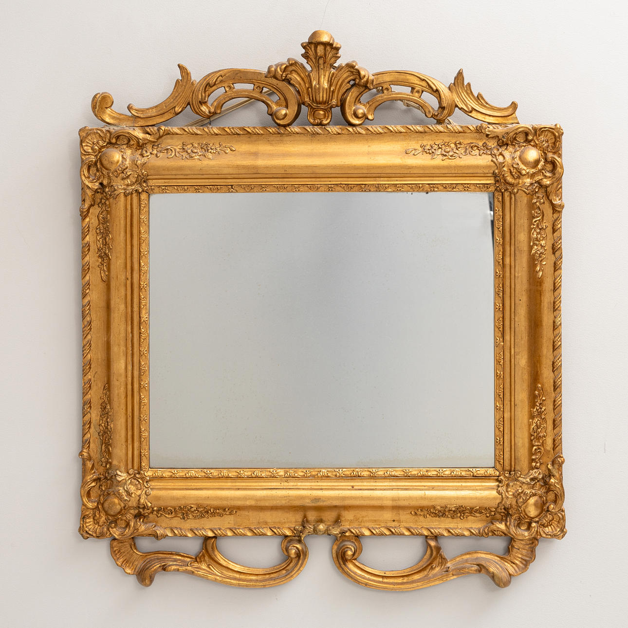 A gilt mirror, Neo-Rococo, 1850s.