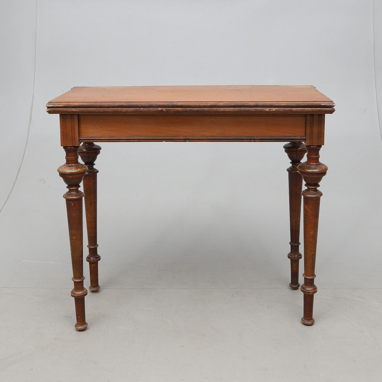 A gaming table, with storage, 1800/20th century.