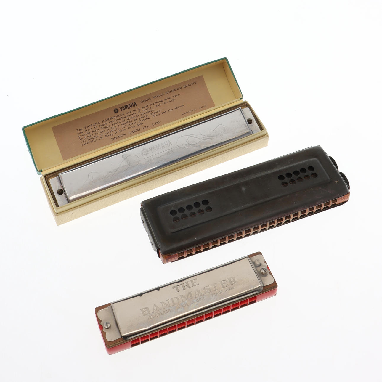 3 harmonica, including Yamaha.