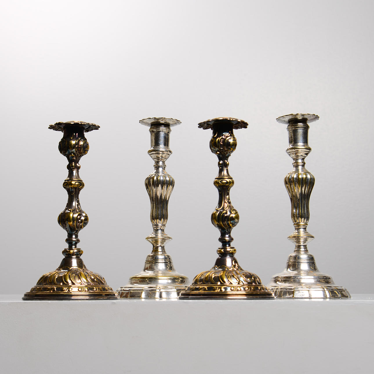 CANDELABROS, 4 piezas de Alpaca.