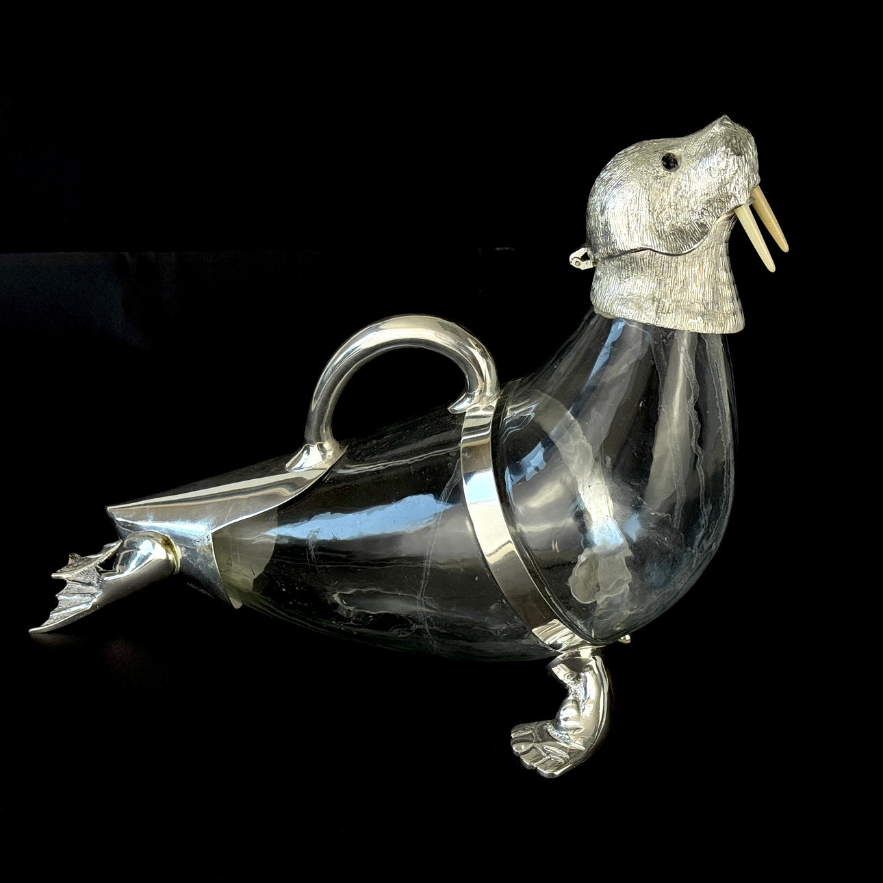 SILVERPLATE & GLASS WALRUS CLARET JUG.