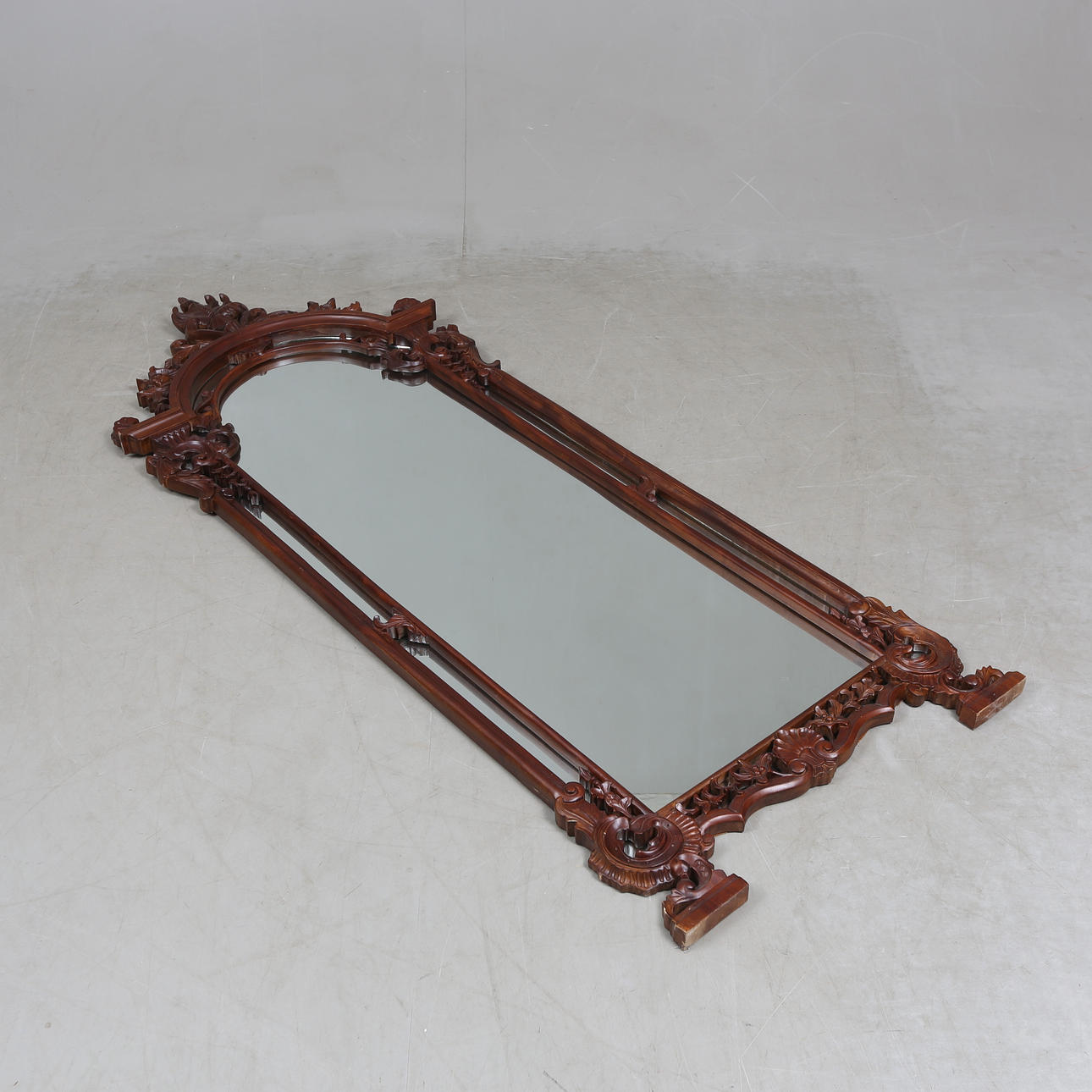 A 20th century rococo style mirror.