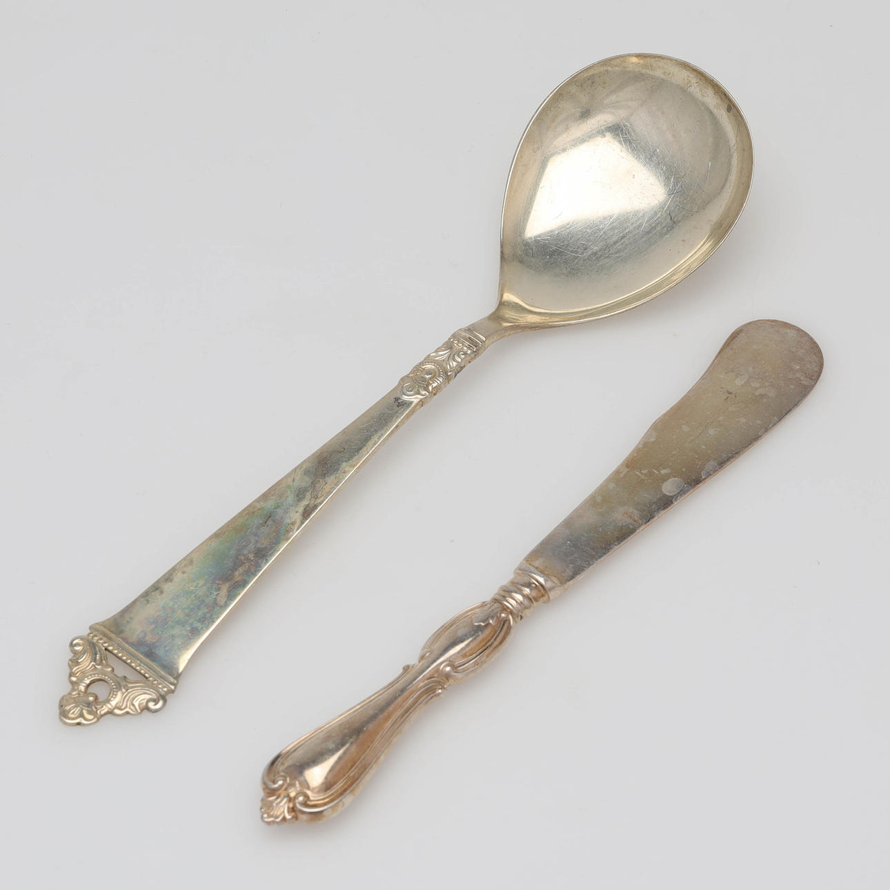 BUTTERMESSER UND KELLE, u.a. „Olga“, Silber.