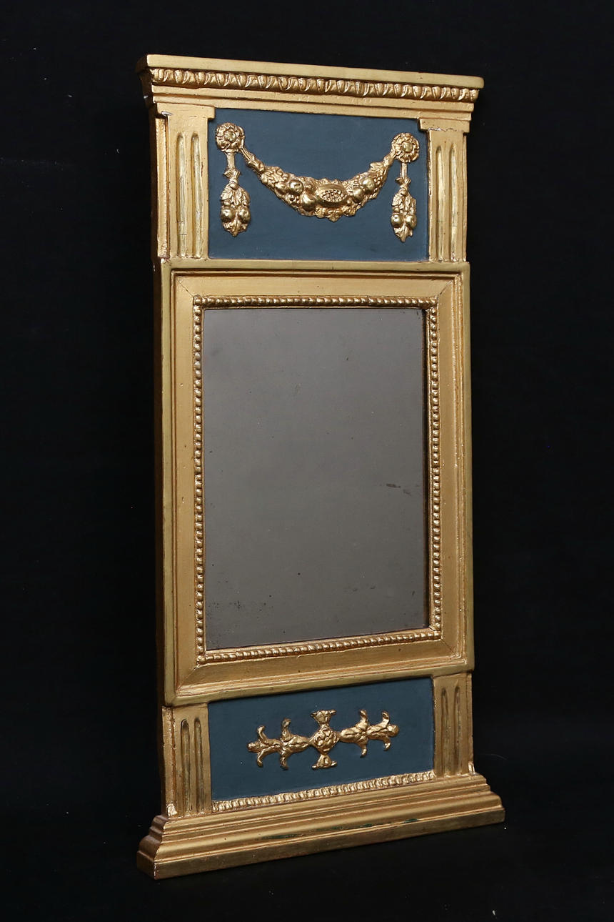 An empire mirror, 19th century.