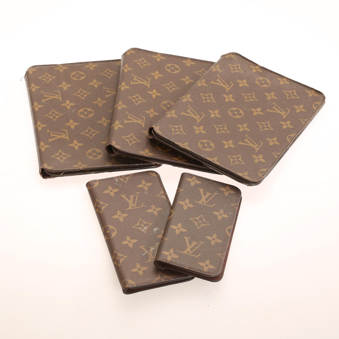 LOUIS VUITTON. 5 pieces, ipad and mobile phone case, monogram.