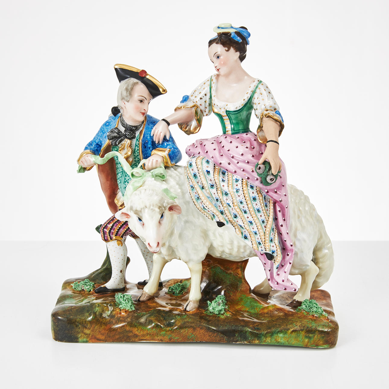 A porcelain figurine group, probably Germany, circa 1900, rococo style, polychrome painted, gold details.