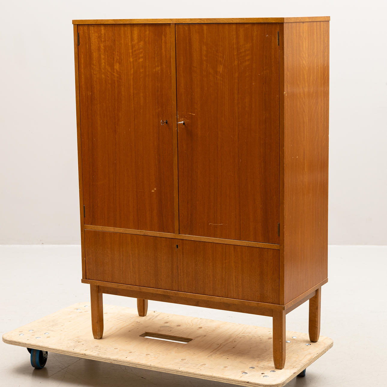 A cabinet, tray marked NK, designed in 1944.