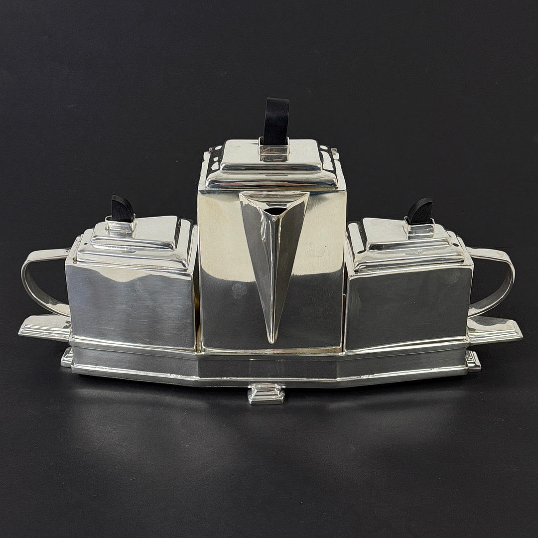 ART DECO STYLE SILVER PLATED TEA SET ON STAND.